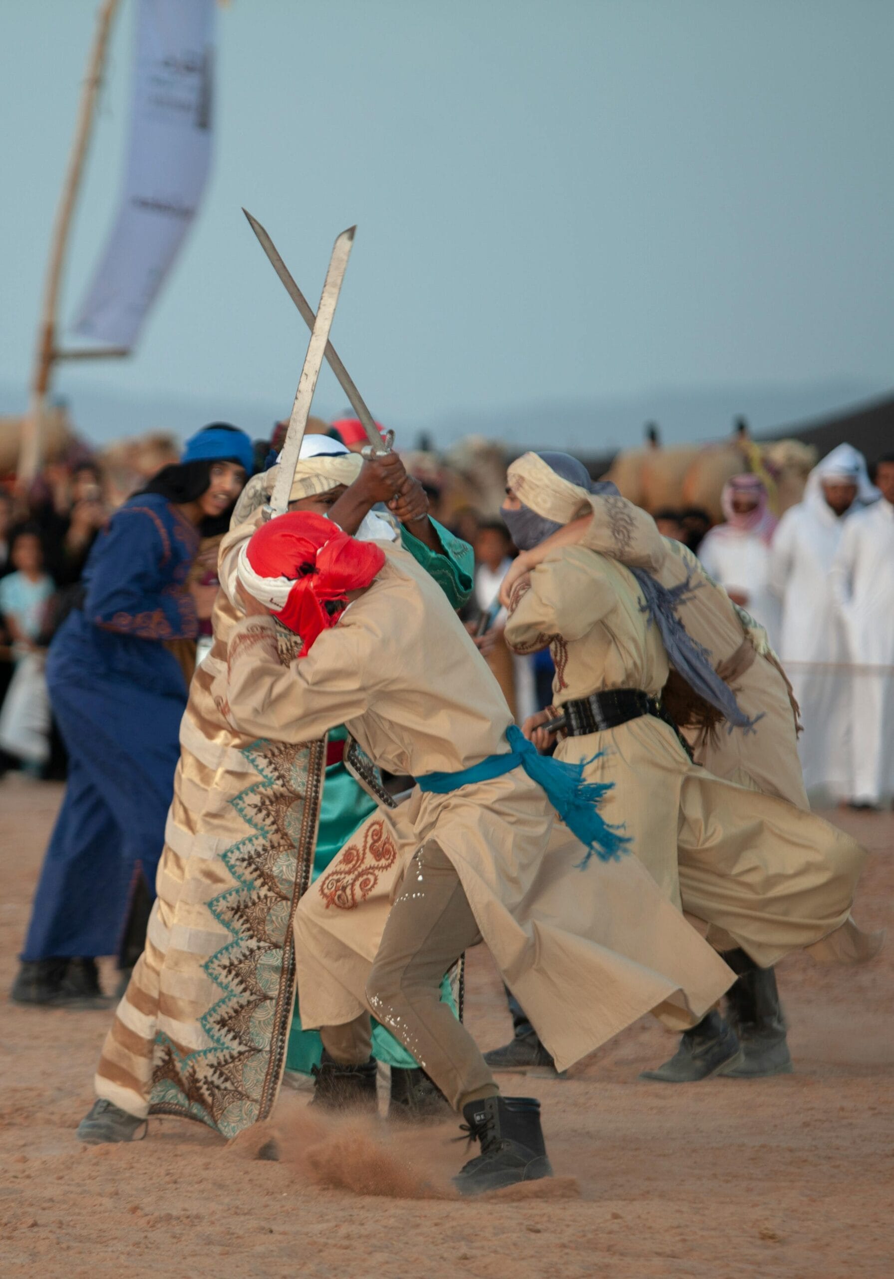 People performing a traditional sword dance at a cultural festival in Saudi Arabia.